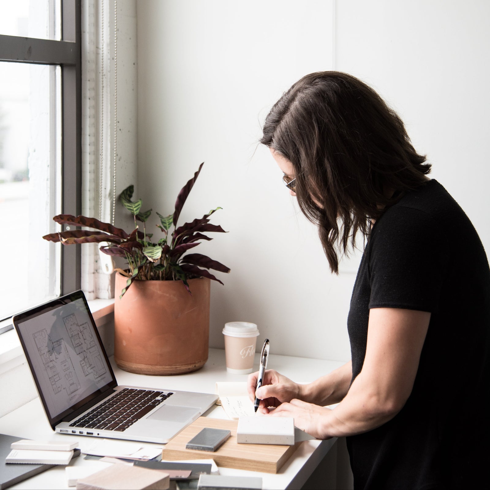 Designer reviewing kitchen plans at a desk